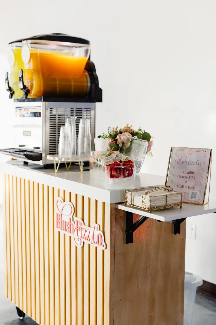 Blush Fizz Co. cart detail with strawberries and polished event styling