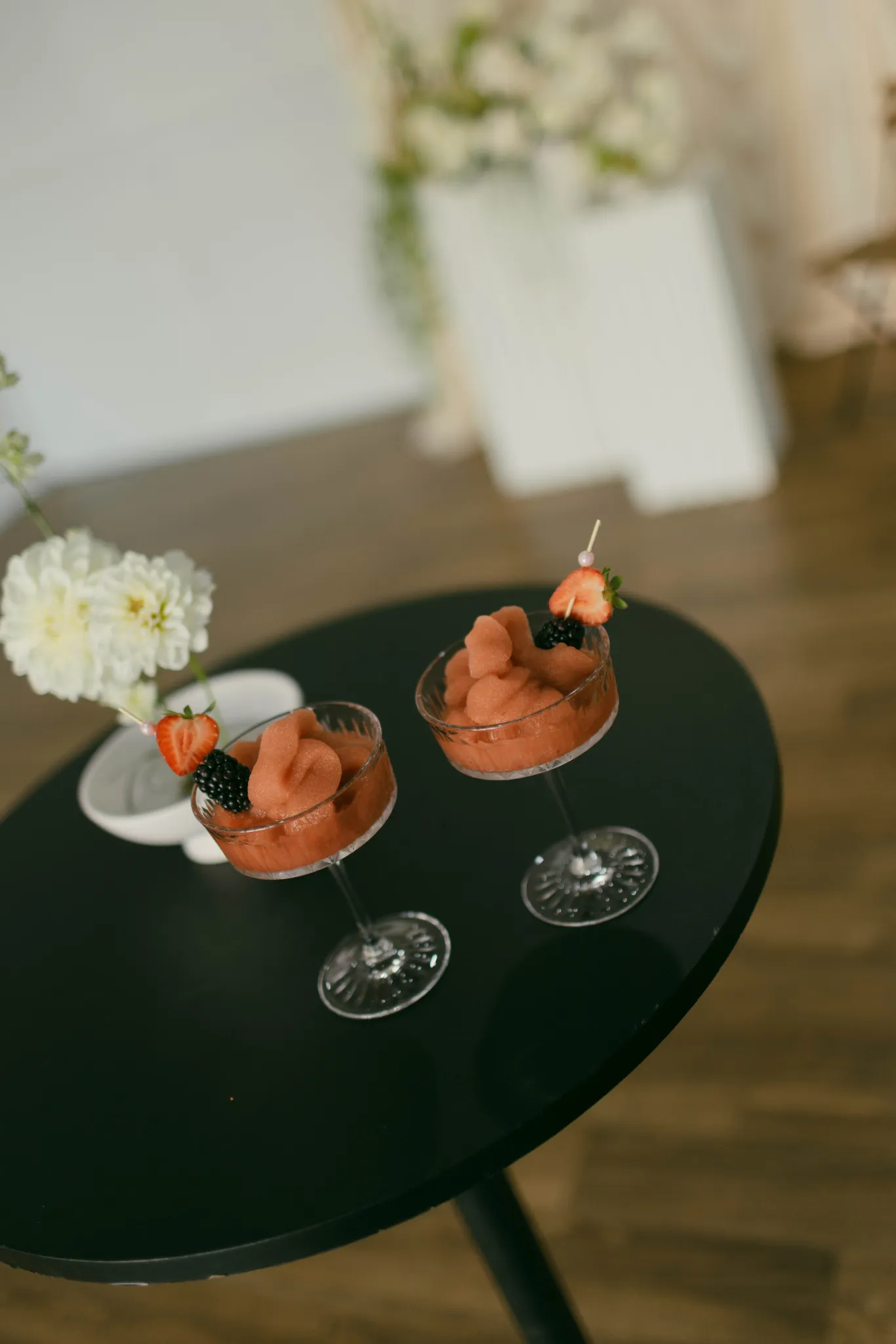 Overhead view of branded Blush Fizz Co. frozen cocktails served in coupe glasses