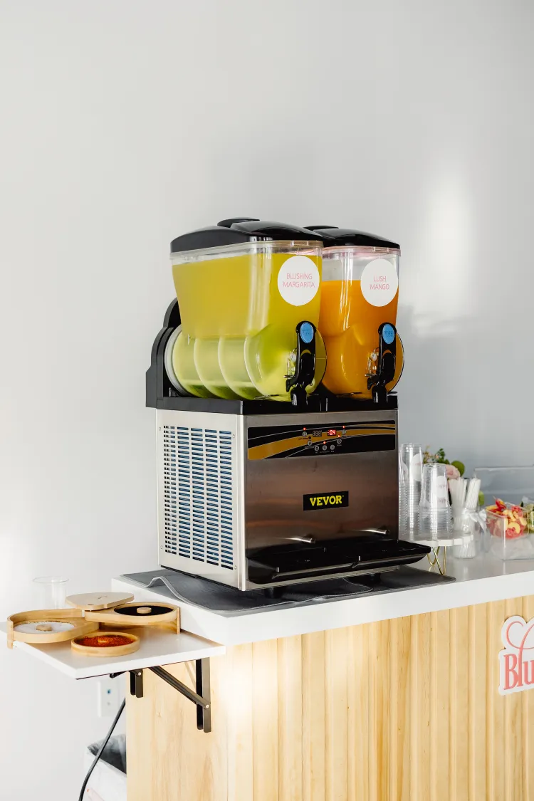 Blush Fizz Co. frozen drink machine and setup prepared for a corporate event