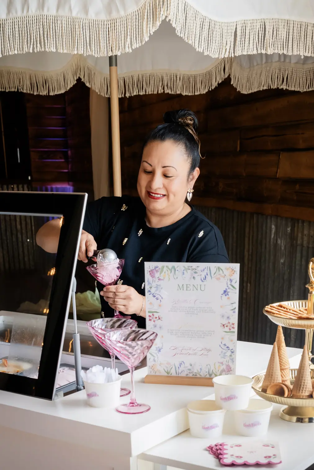 Blush Fizz Co. server preparing a gelato coupe at a daytime celebration