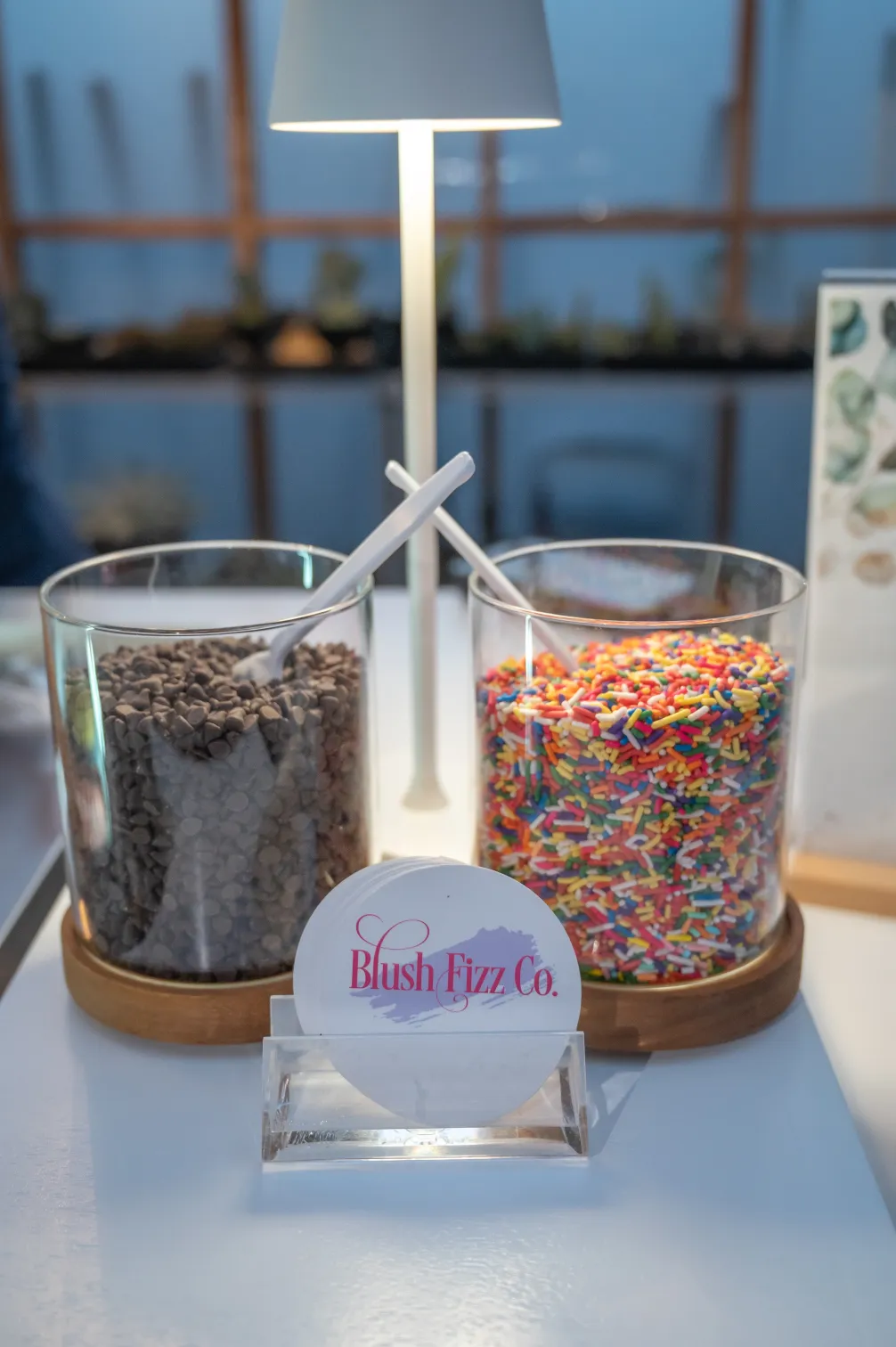 Premium dessert toppings arranged for a Blush Fizz Co. sundae bar